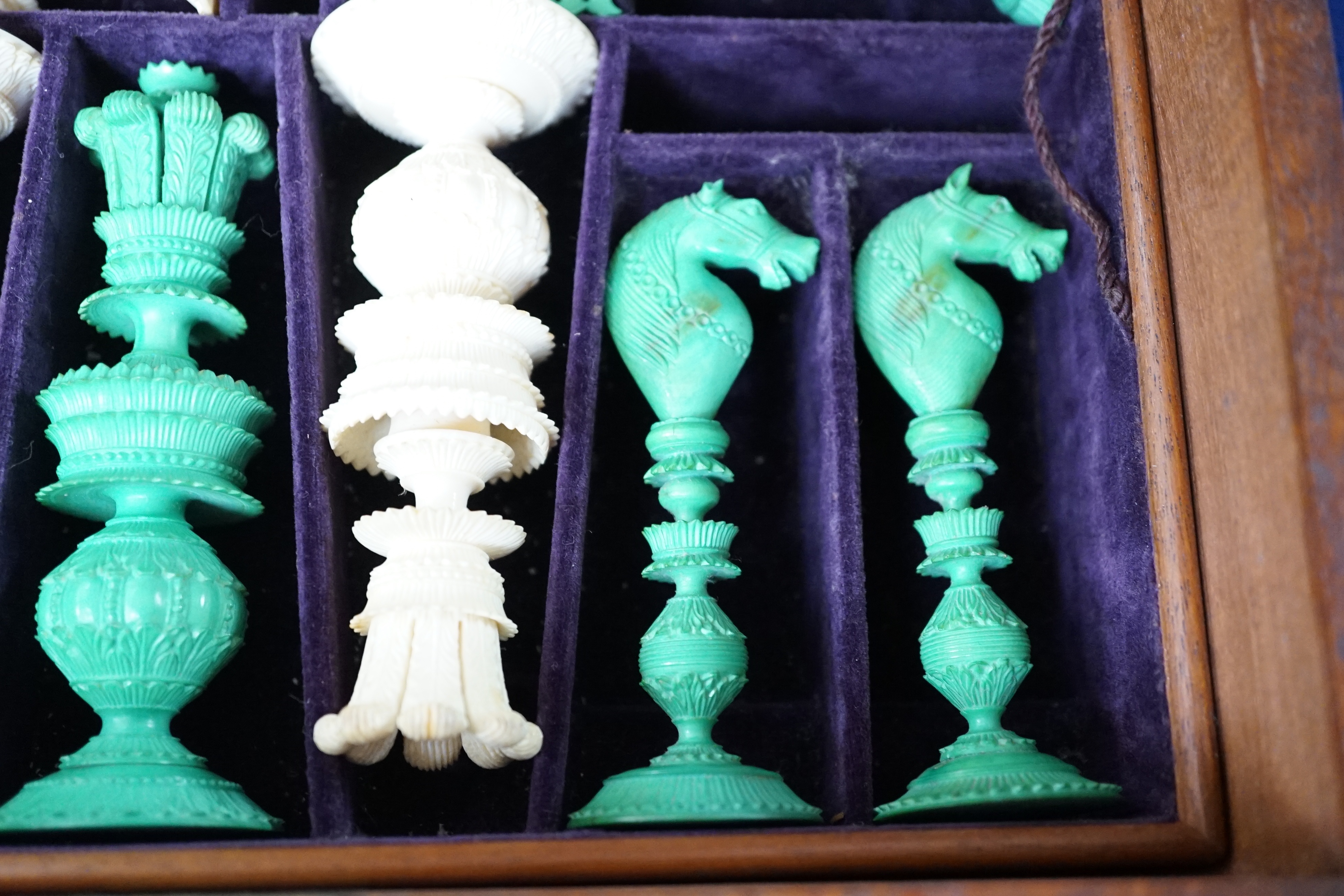 A boxed 19th century Burmese pattern ivory chess set, one pawn restored, king height 11cm